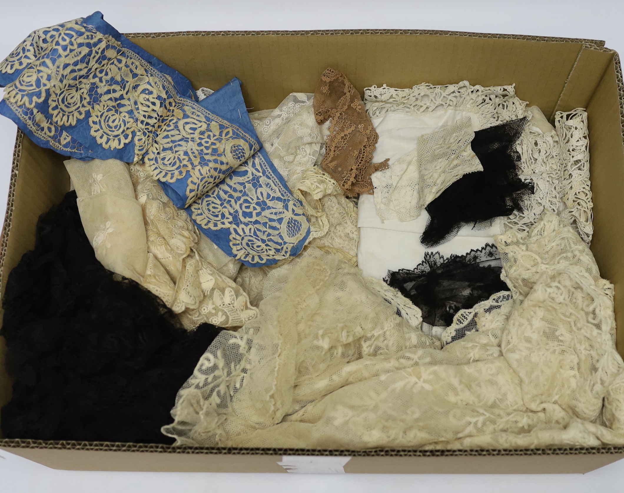 19th century mixed hand made and machine lace: a cream lace needle run bonnet veil, a similar stole and two lengths of wide trimming, together with other lace items and a quantity of black lace
